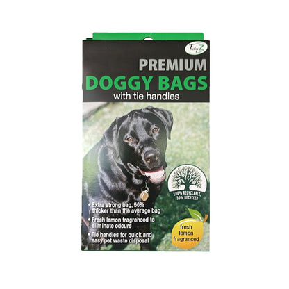 Premium doggy bags in a green and black package, featuring a smiling black dog, with tie handles for easy waste disposal.