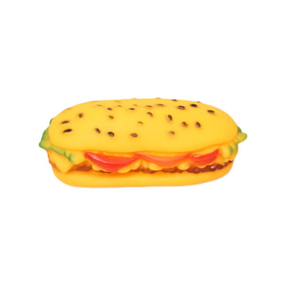 Bright yellow squeaky dog toy shaped like a sandwich, featuring colorful toppings and a textured bun.